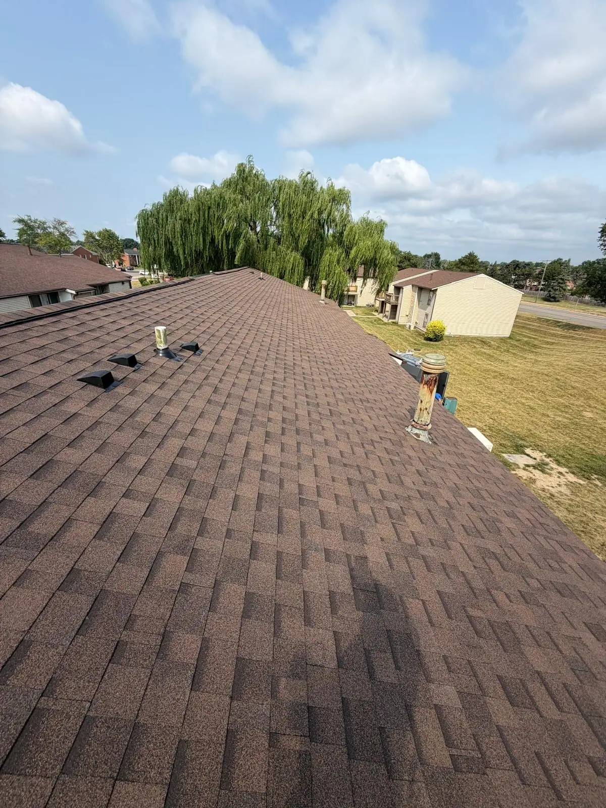 New shingles across the apartment buildings