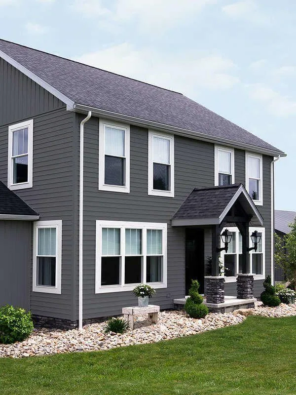 Gray sided home with a new roof