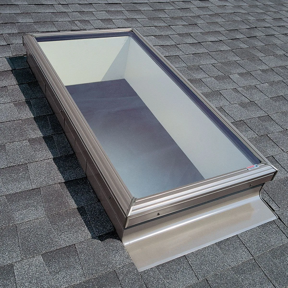 New skylight installed in a shingle roof